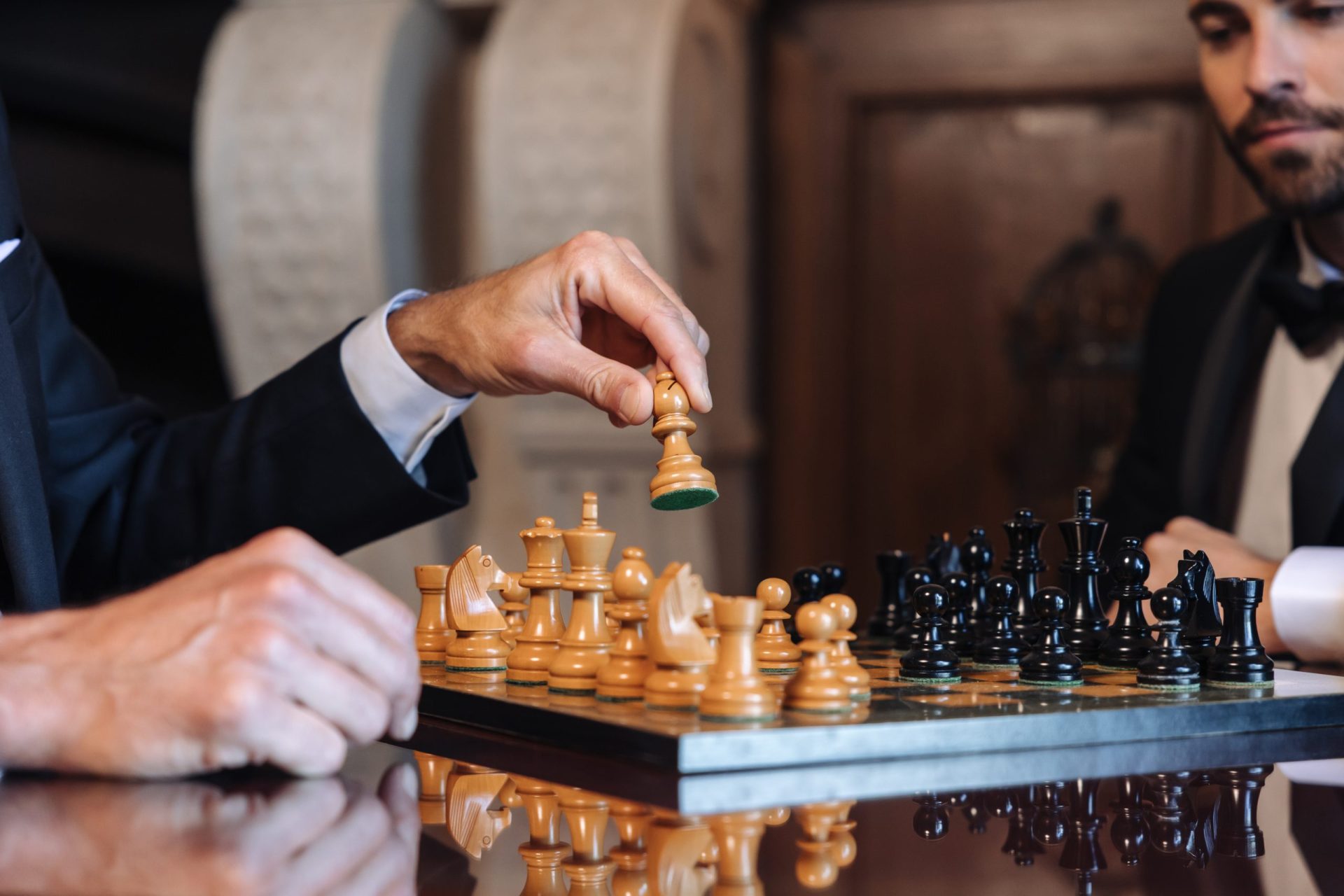 Two guests playing chess, a close view of the board