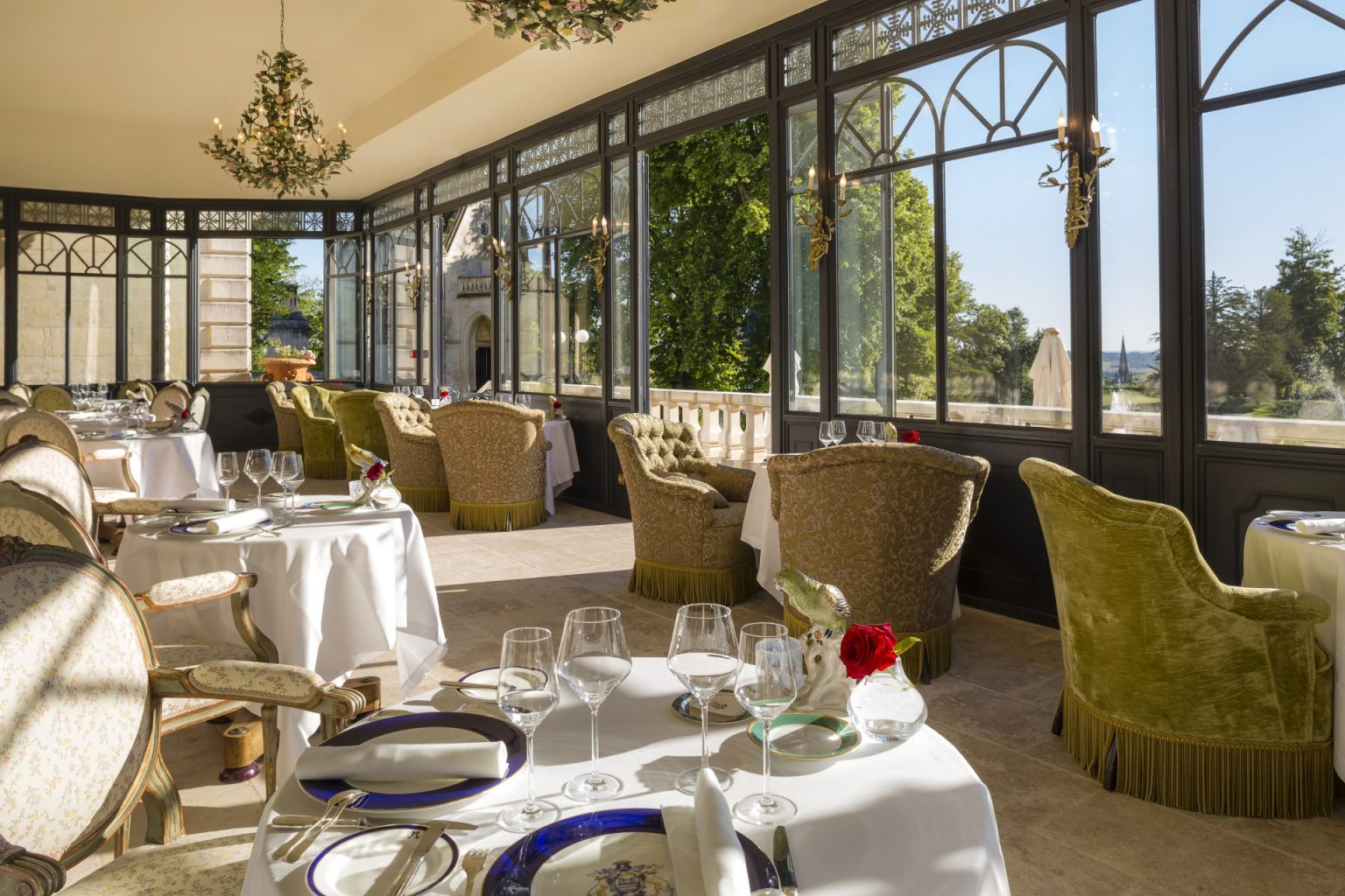 The Veranda set for dinner under its glass roof