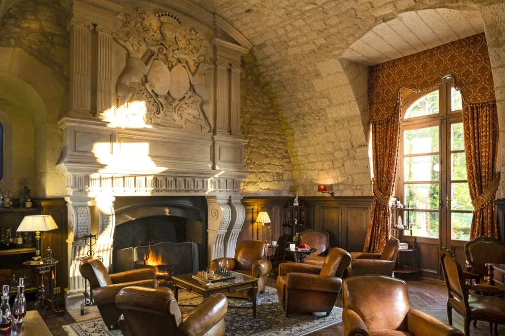 The Cognathèque with its carved stone fireplace, vaulted ceiling and leather armchairs